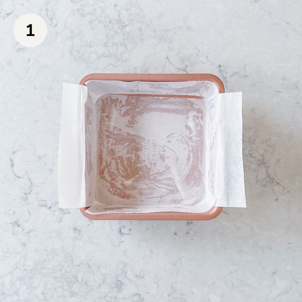 Square baking tin lined with baking paper.