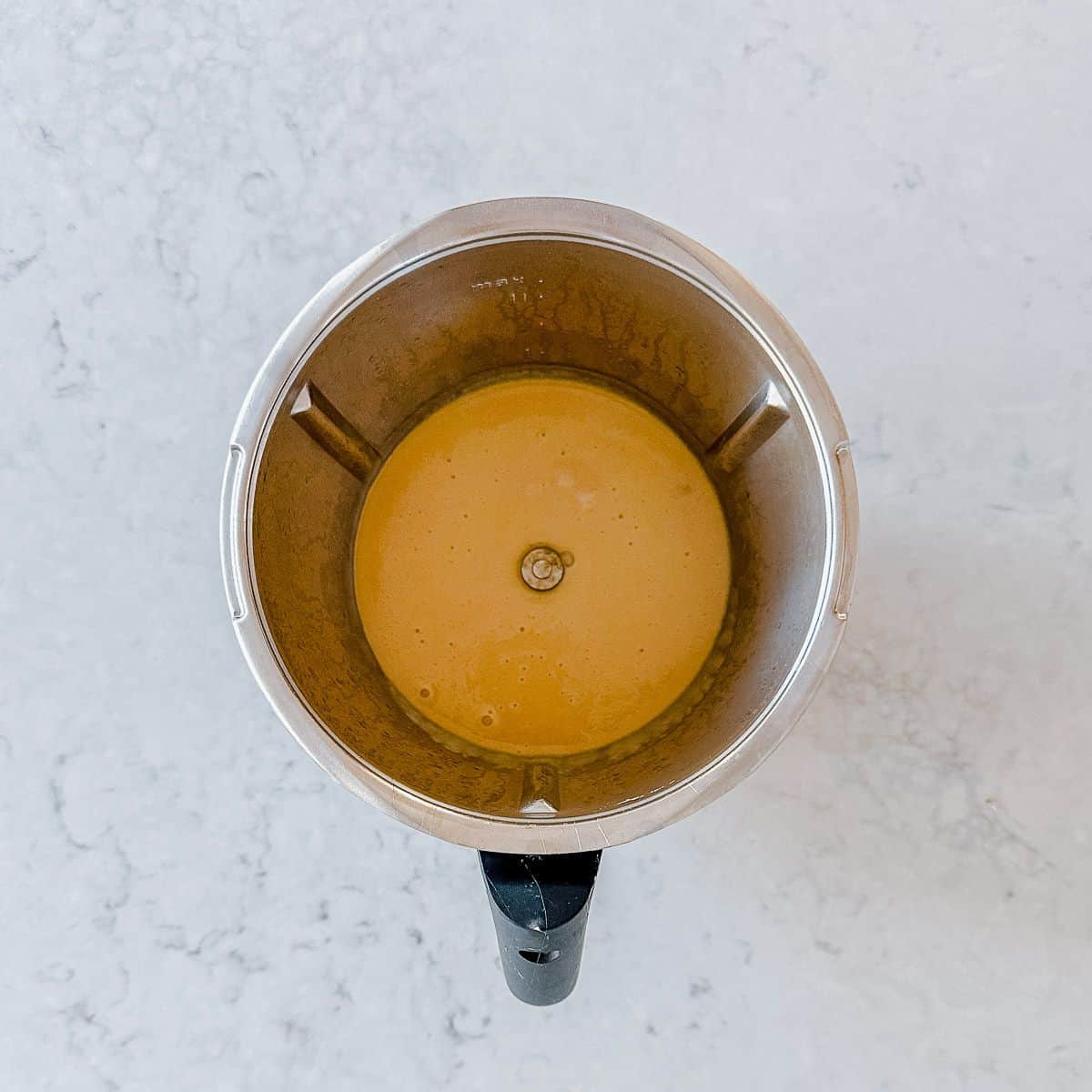 Caramel fudge ingredients in a Thermomix Bowl.