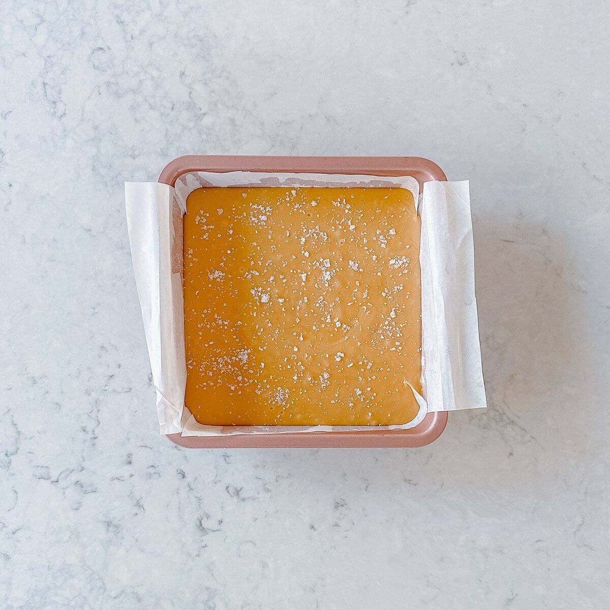 Caramel Fudge in a pink square baking tin.