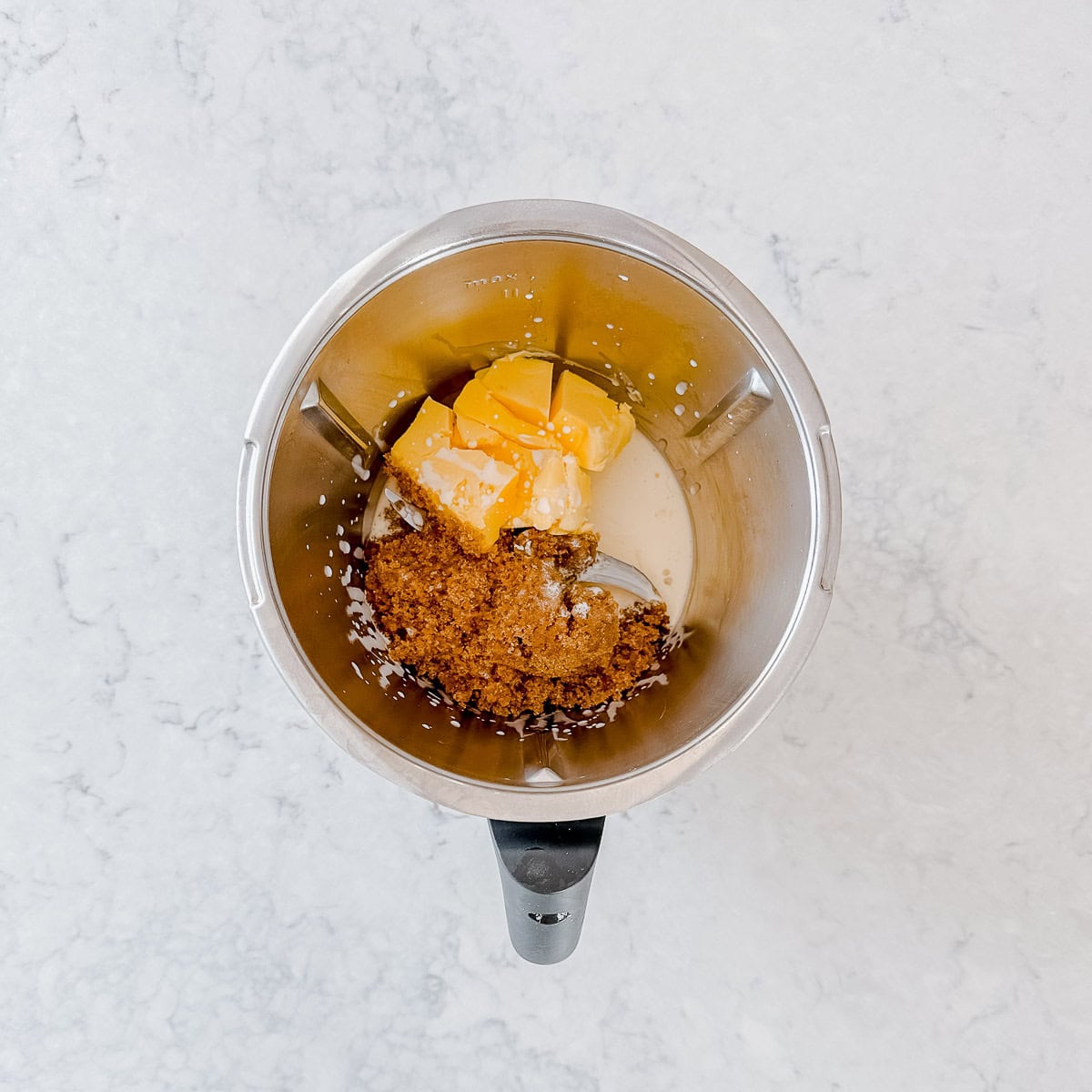 Brown sugar, cream and butter in a Thermomix bowl.