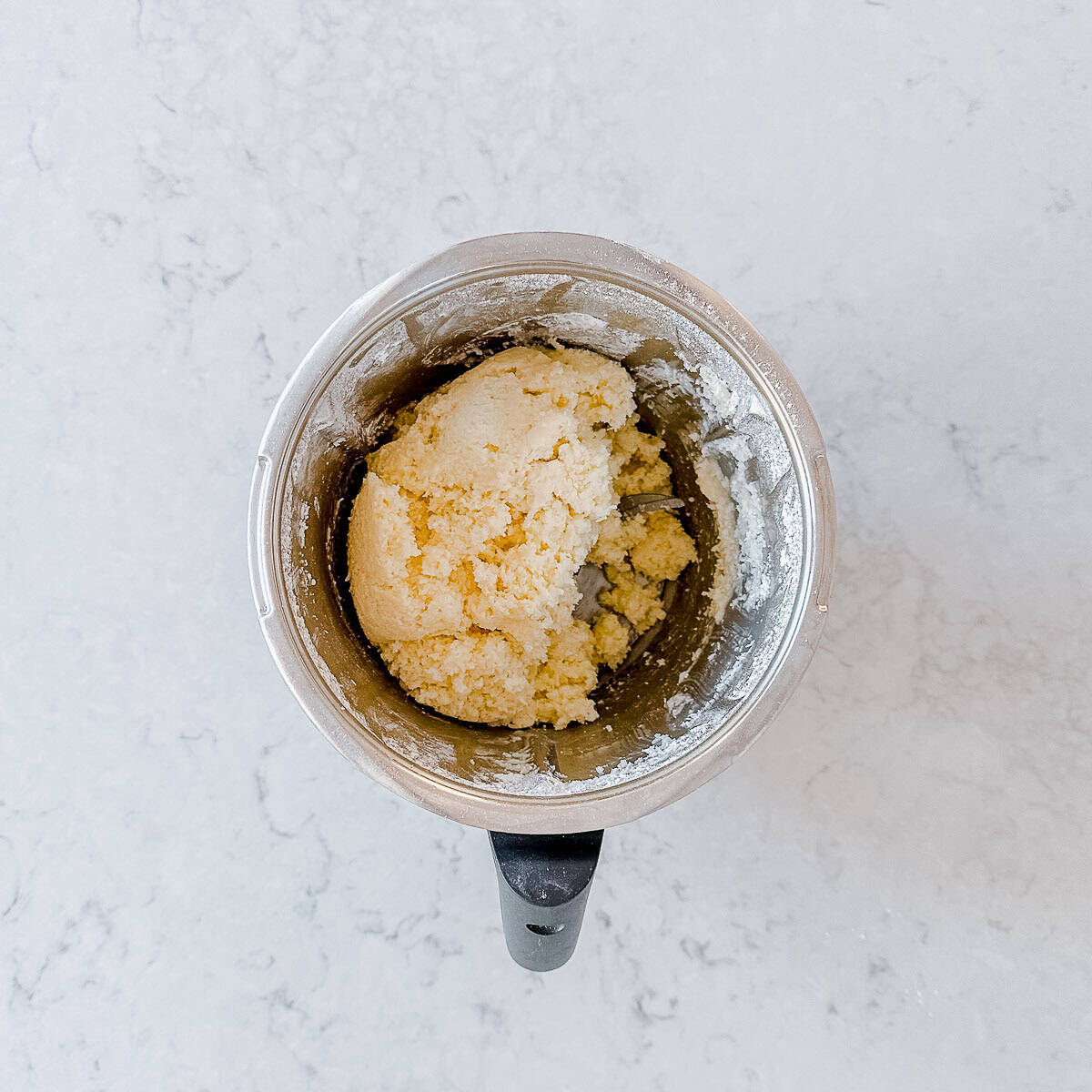 Overhead image of Coconut Ice mixture in a Thermomix bowl.