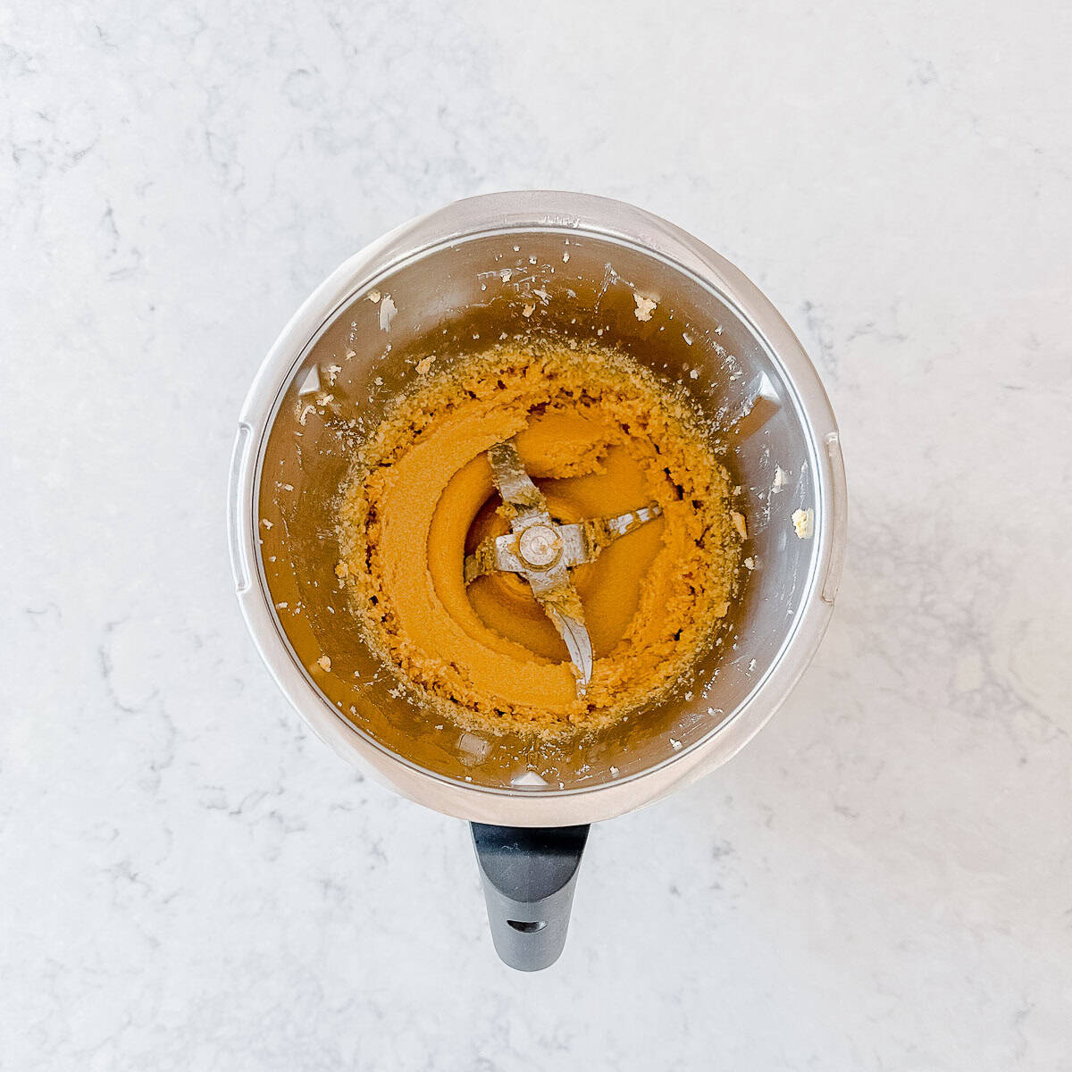 Creamed butter and sugar in a Thermomix bowl.