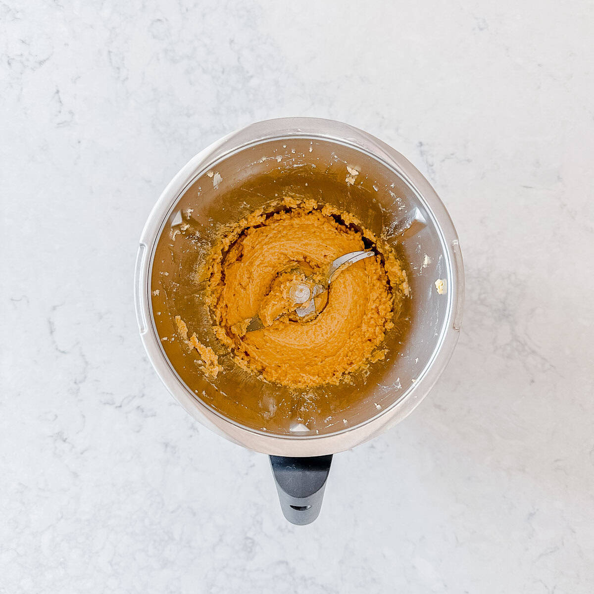 Cookie batter in a Thermomix bowl.