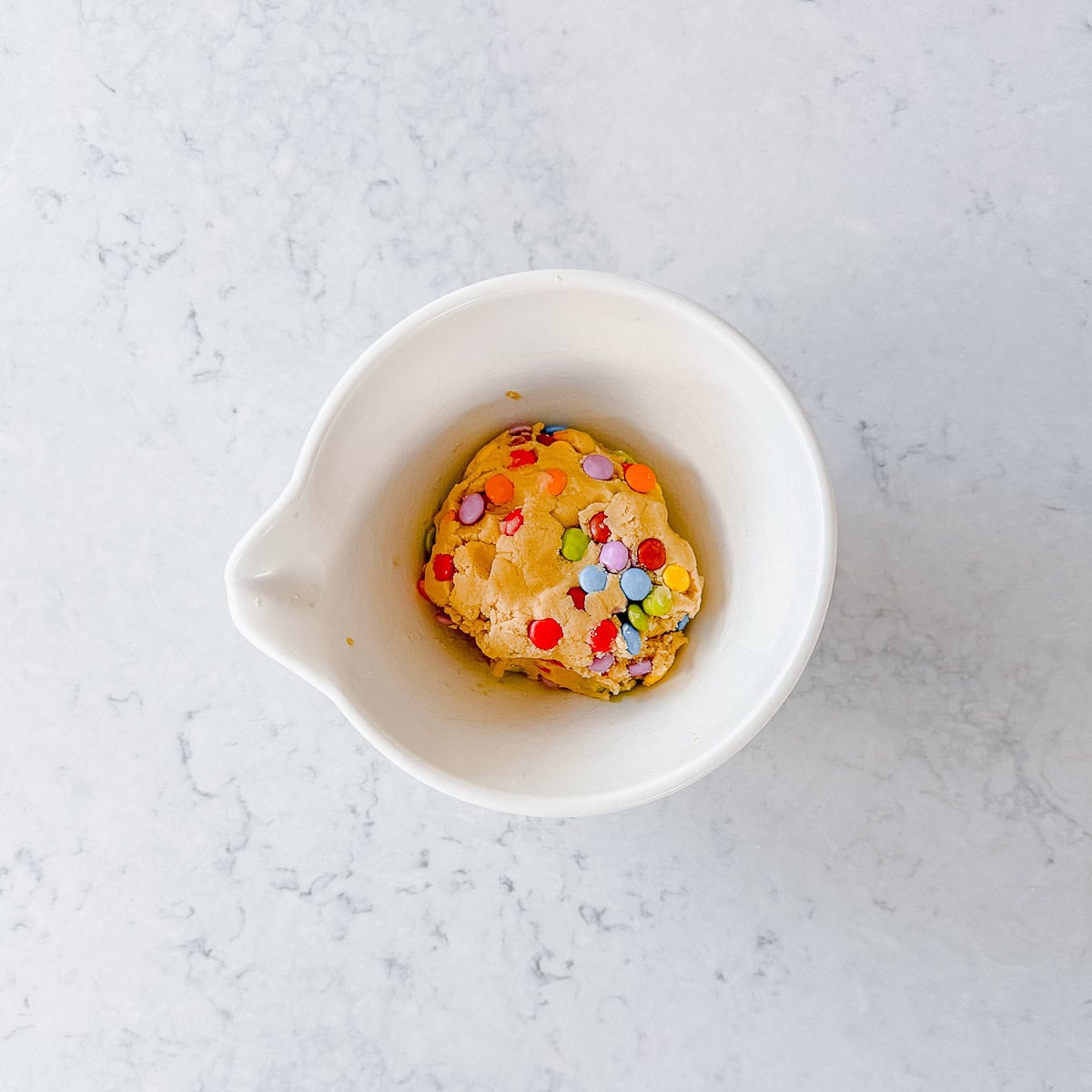 Smartie Cookie Dough in a cream bowl.