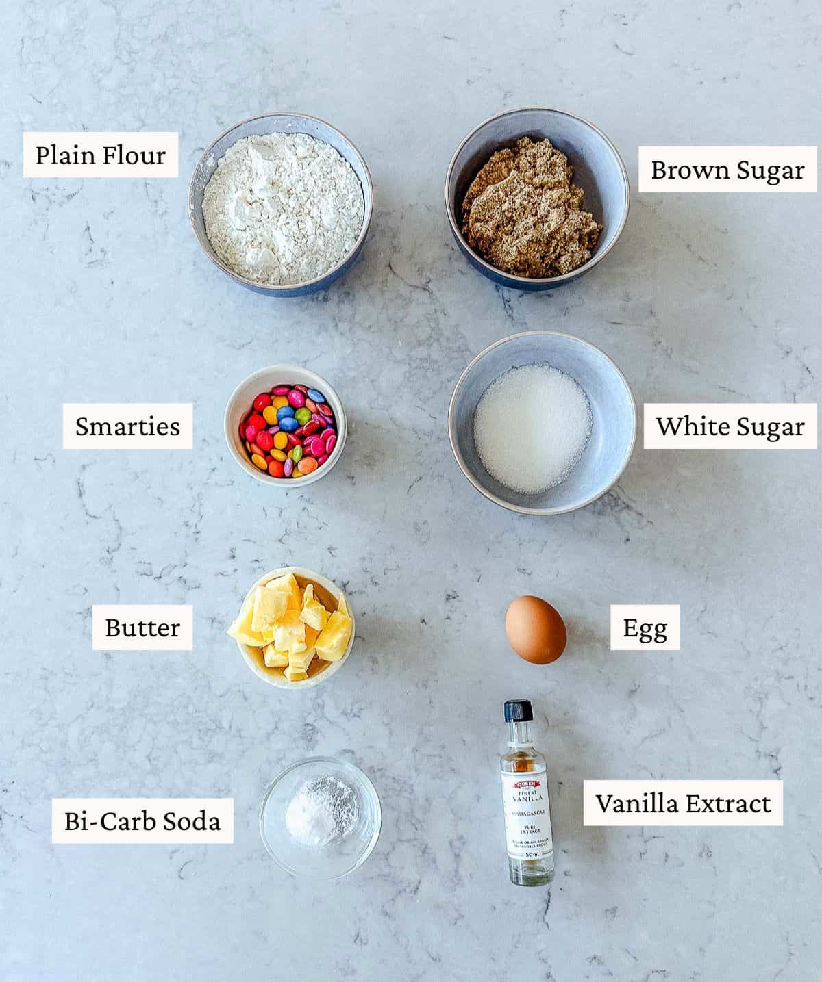 A collection of ingredients used to make Smartie Cookies.