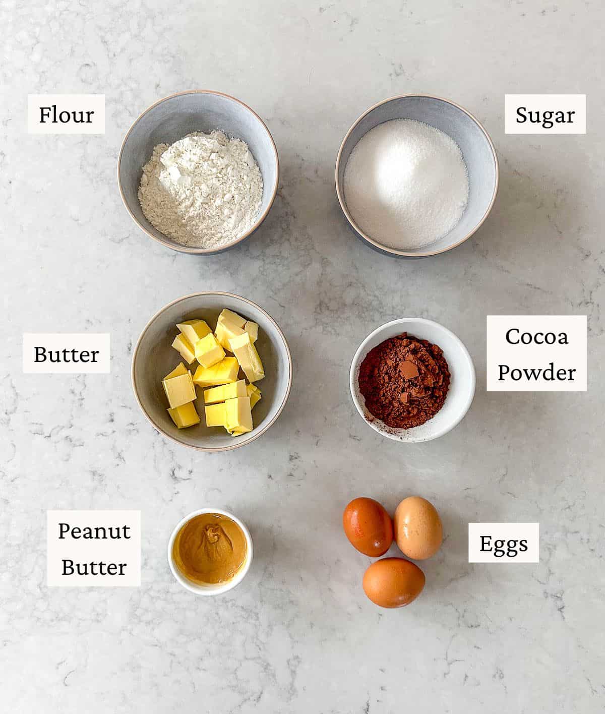 A collection of ingredients needed to make peanut butter brownies.