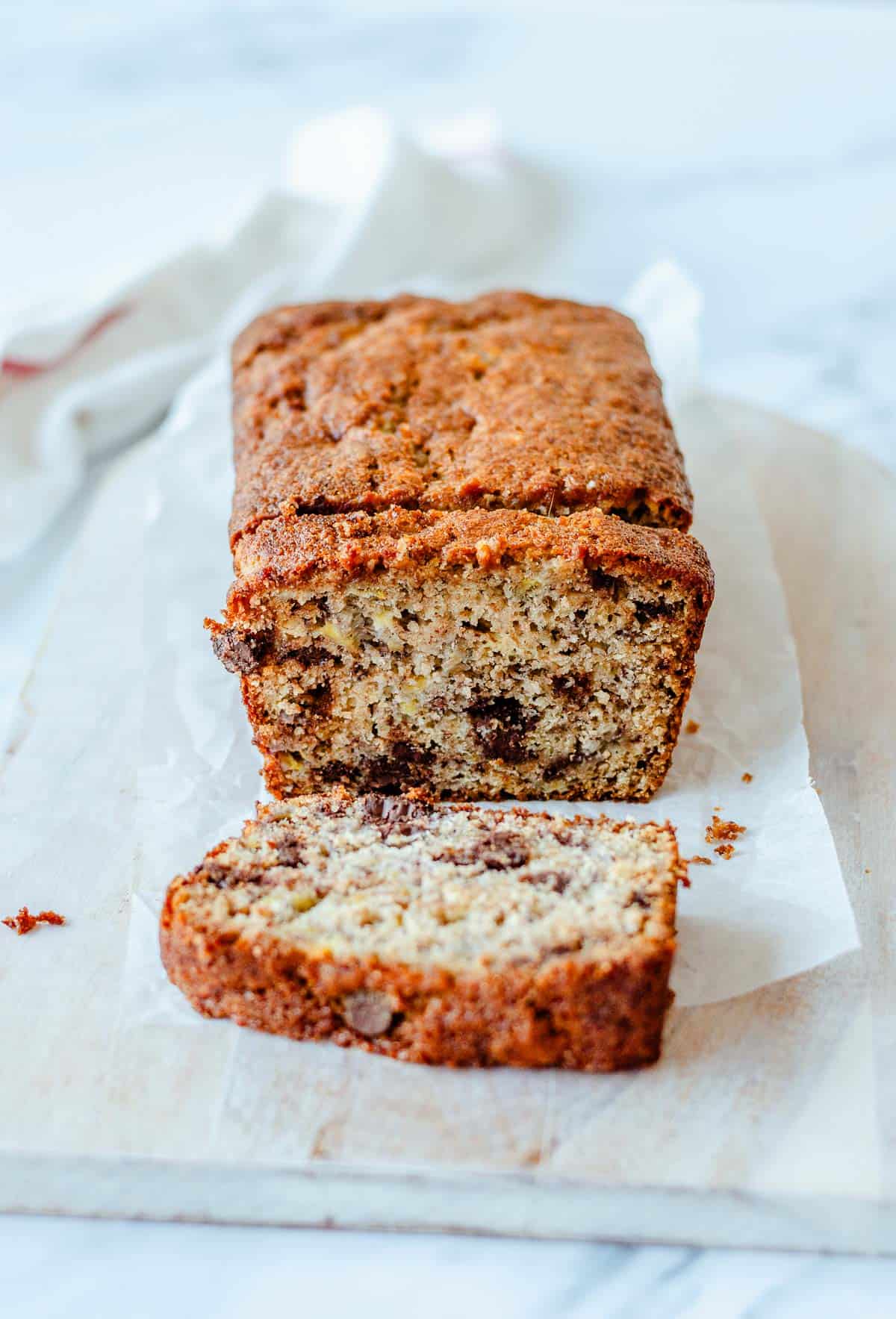 Sliced chocolate chip banana bread showing a moist crumb studded with dark chocolate chips.